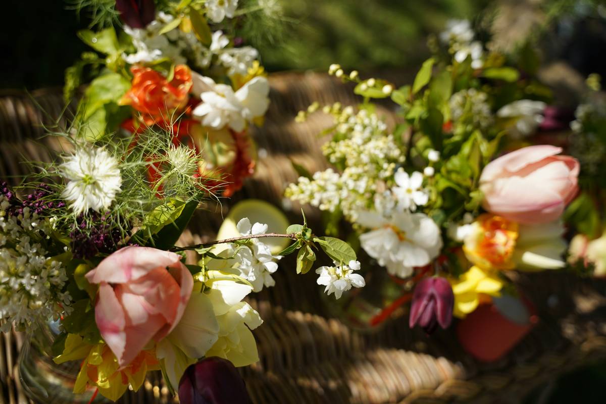 Hand-tied organic flower gift boxes wrapped in kraft paper with dried lavender and linen ribbon